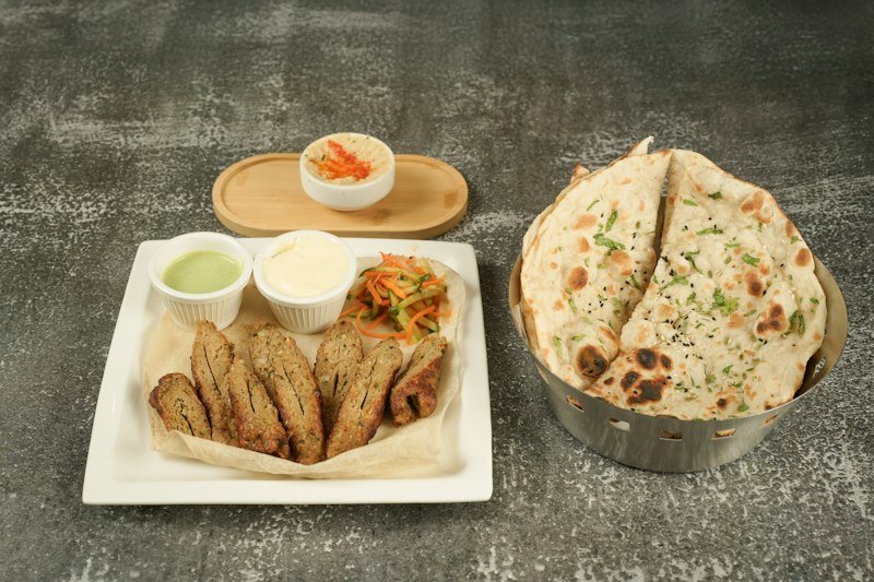 Naan bread served with gravy and dips